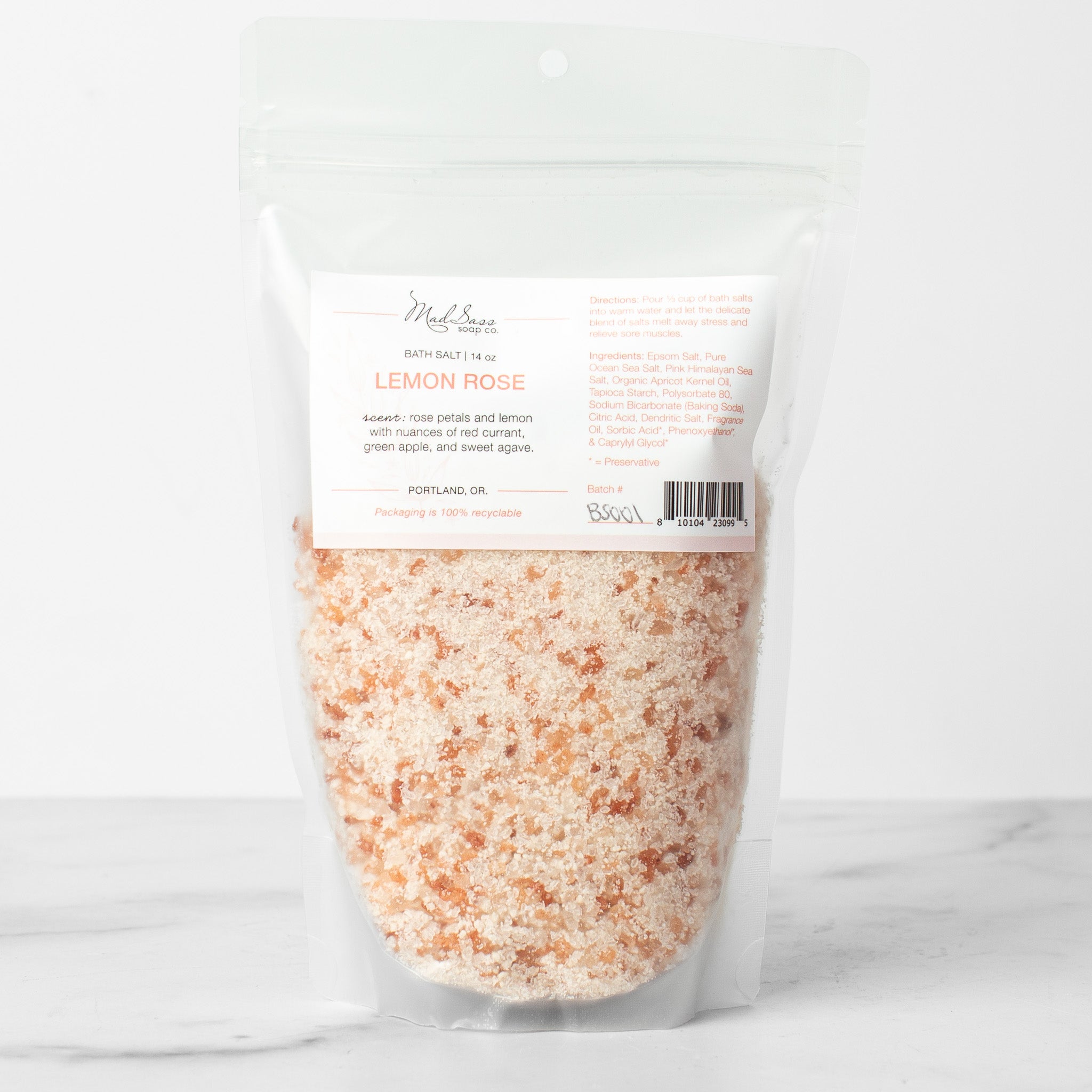 One bag of Lemon Rose bath salts on a white background. Lemon Rose is a mixed pink and dark pink bath salt.