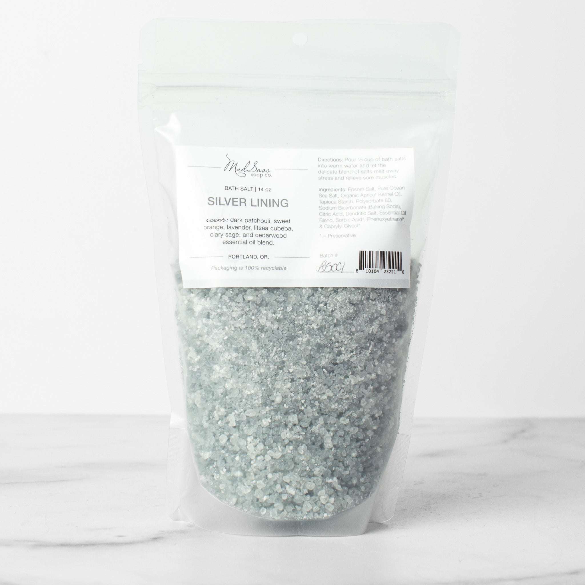 One bag of Silver Lining bath salts on a white background. Silver Lining is a mixed grey and white bath salt.