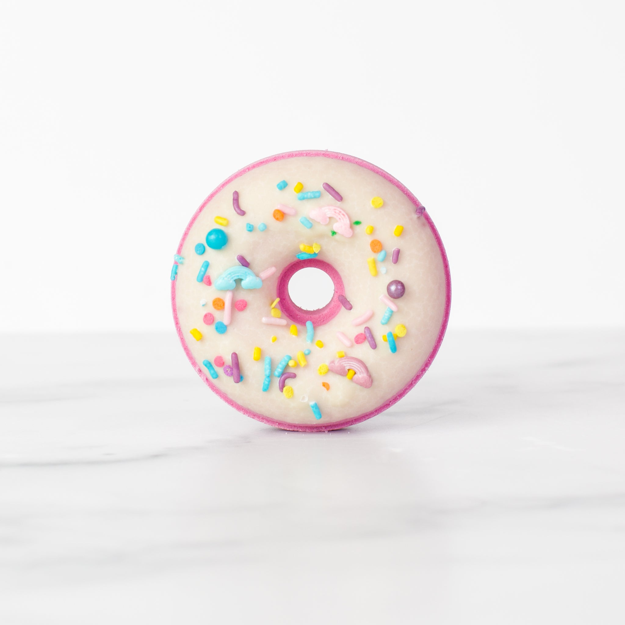 Happy Hour bath bomb by Mad Sass Soap Co - single view of a vibrant donut-shaped hydrating luxury bath bomb, adorned with playful sprinkles.