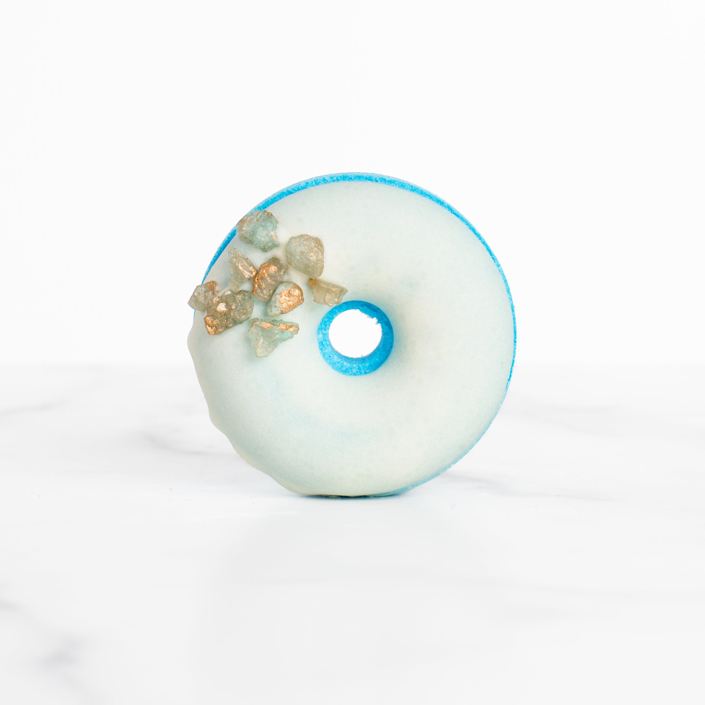 Elegant Sea Salt & Neroli bath bomb by Mad Sass Soap Co, presented in a refined donut shape with gemstones, perfect for a truly hydrating luxury bath bomb indulgence.