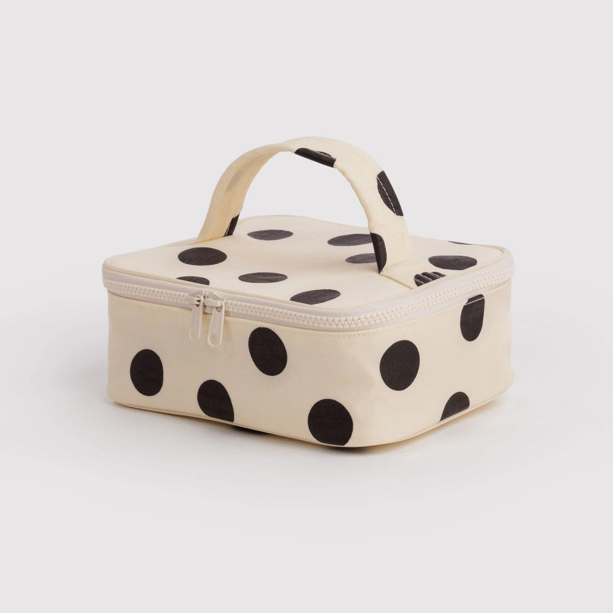Polka dot cosmetic case on a white background